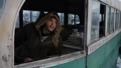 The 5 Best Movies to Travel : Christopher McCandless in his blue bus during his road trip in Alaska