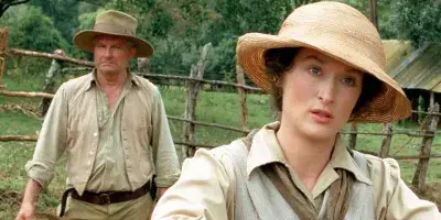 The 5 Best Movies to Travel : Karen Blixen looking lost in thoughts during her travel to Africa